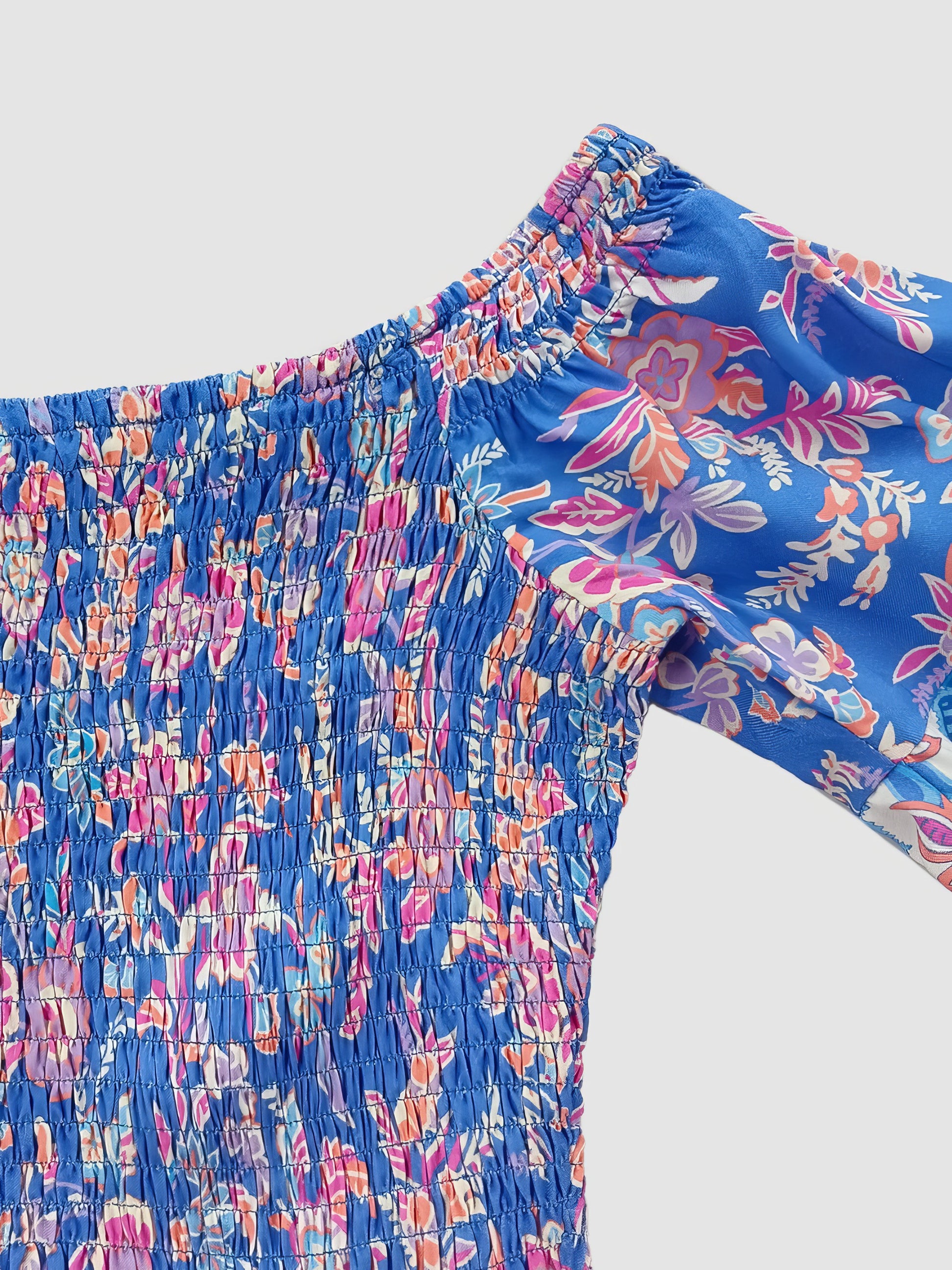 Blue floral patterned pants on a light gray background