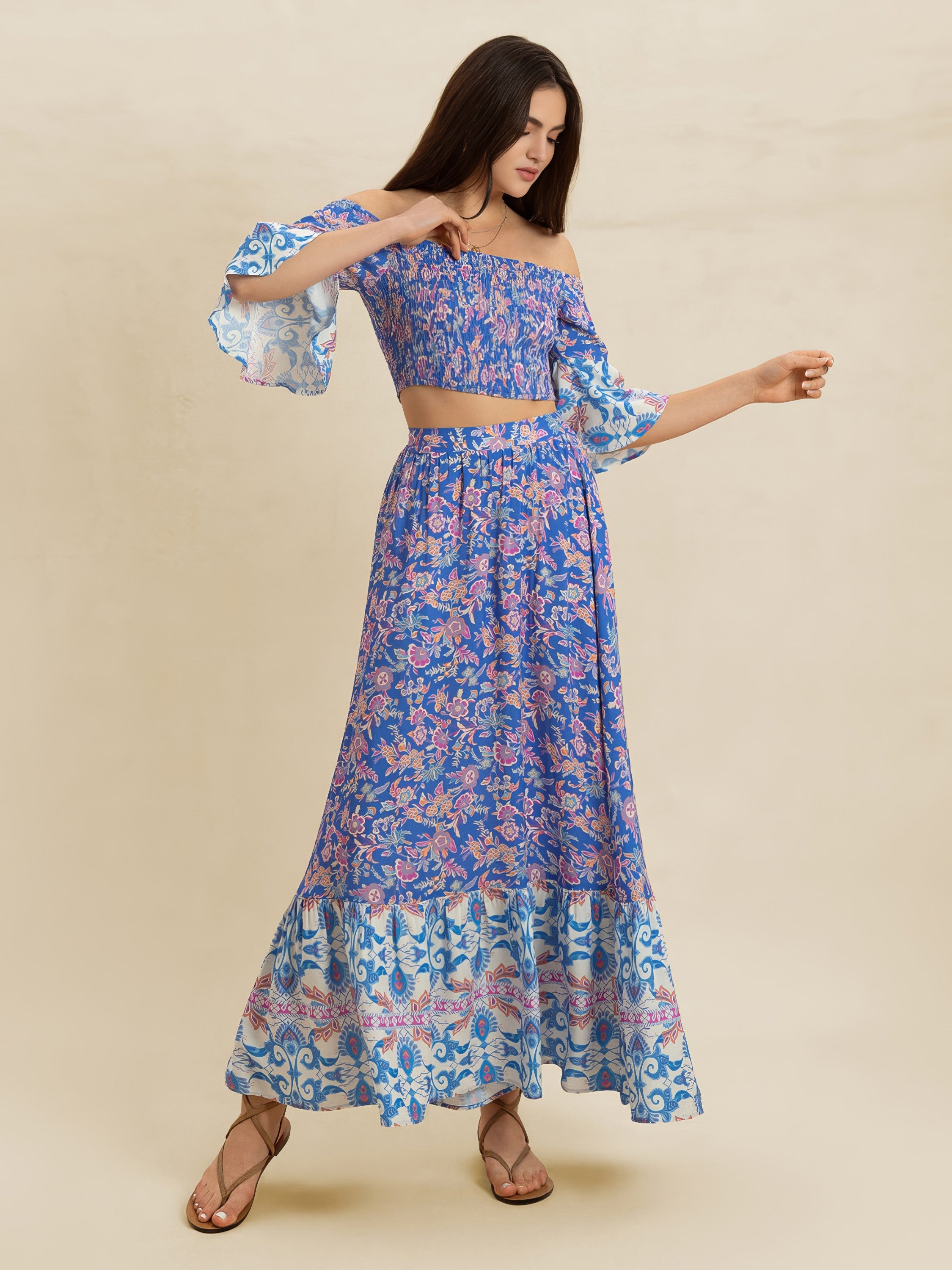Woman wearing a blue floral dress on a beige background