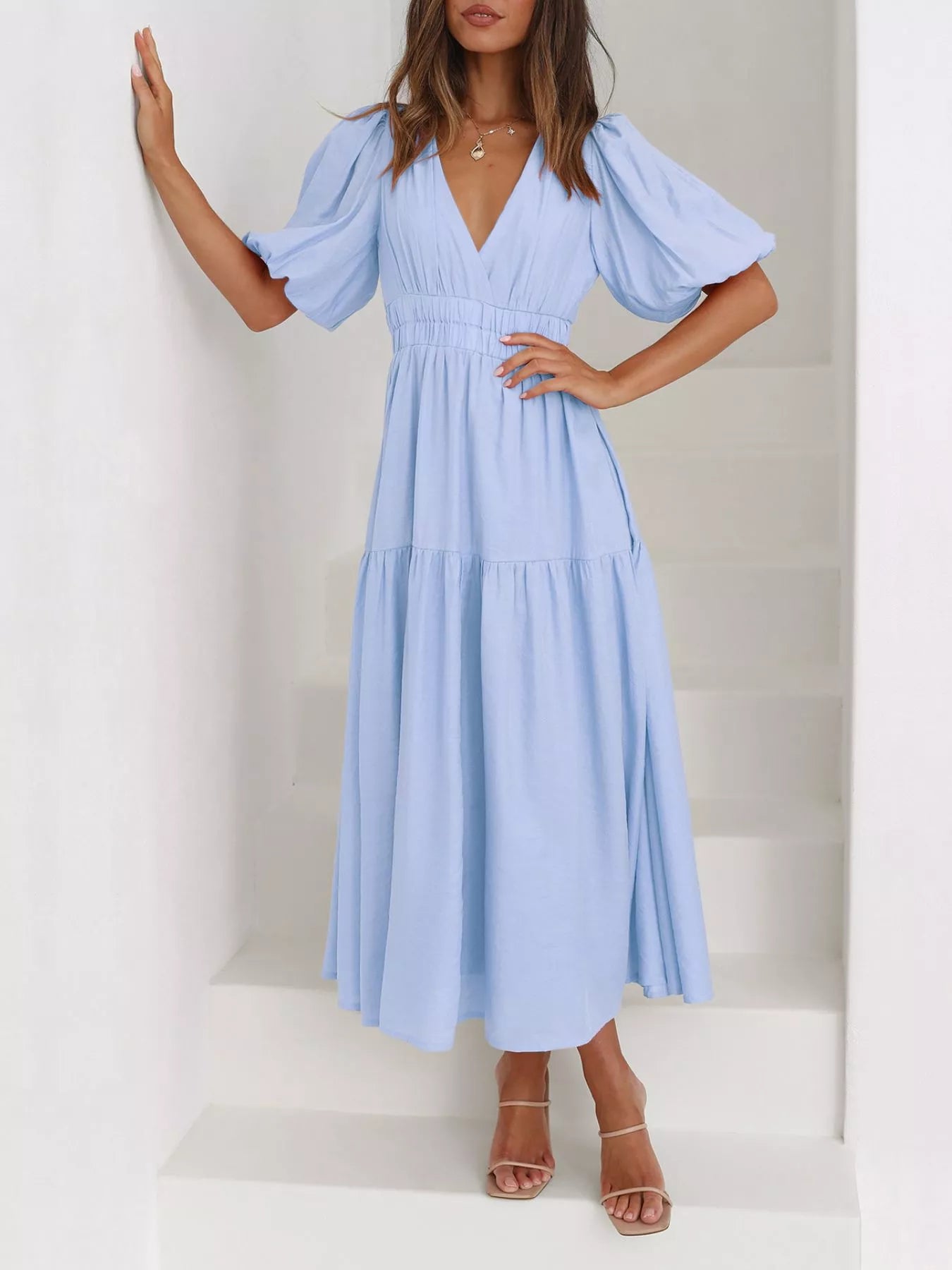 Cream tiered midi dress with a V-neck, smocked waist, and short puff sleeves