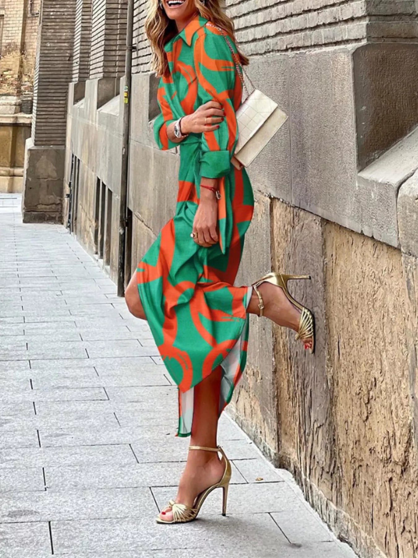 Green and red abstract-print collared midi shirt dress with three-quarter sleeves and a tied waist