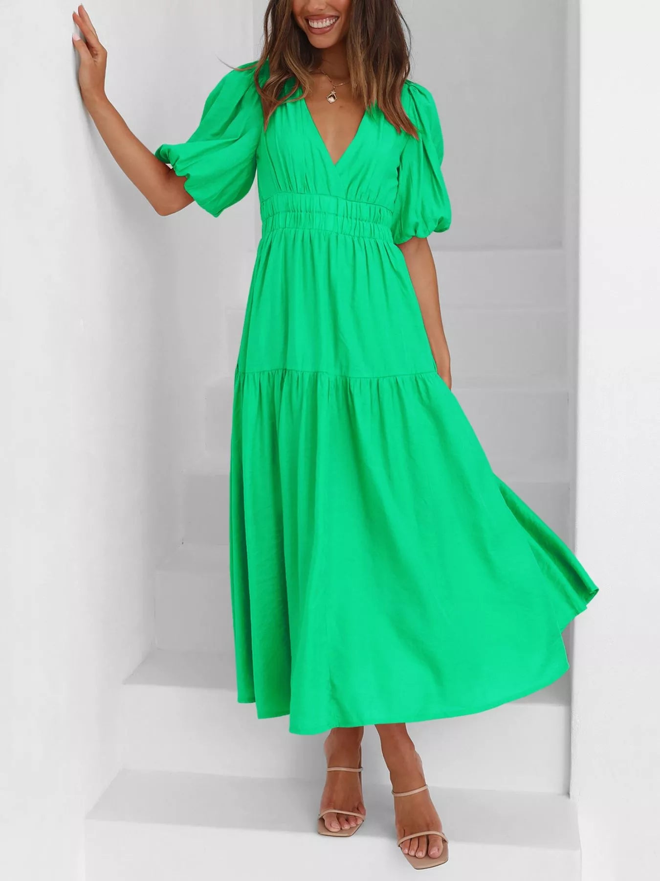 Cream tiered midi dress with a V-neck, smocked waist, and short puff sleeves