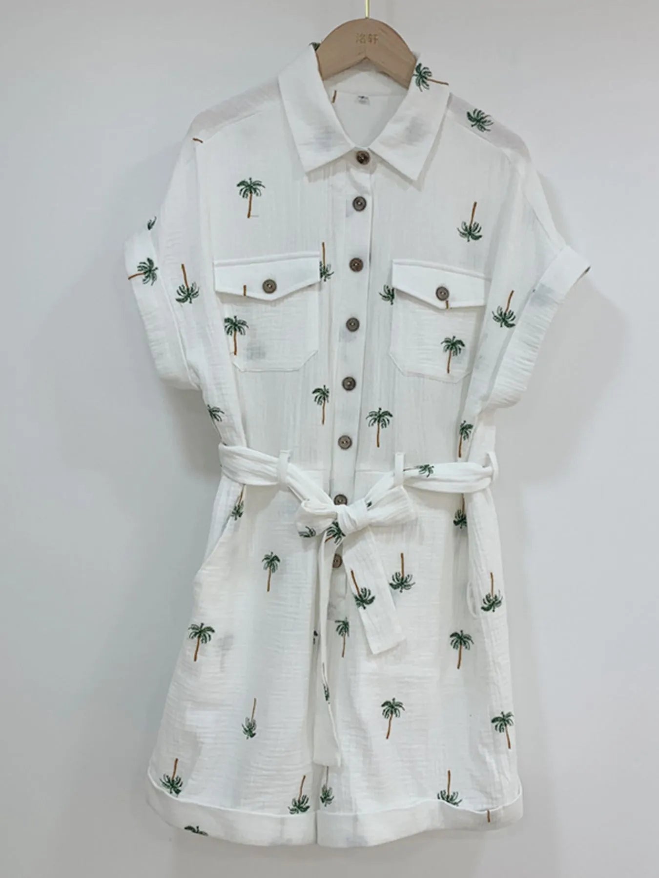 Palm Tree Print Short Sleeve Button-Up Romper with Belt and Pockets.