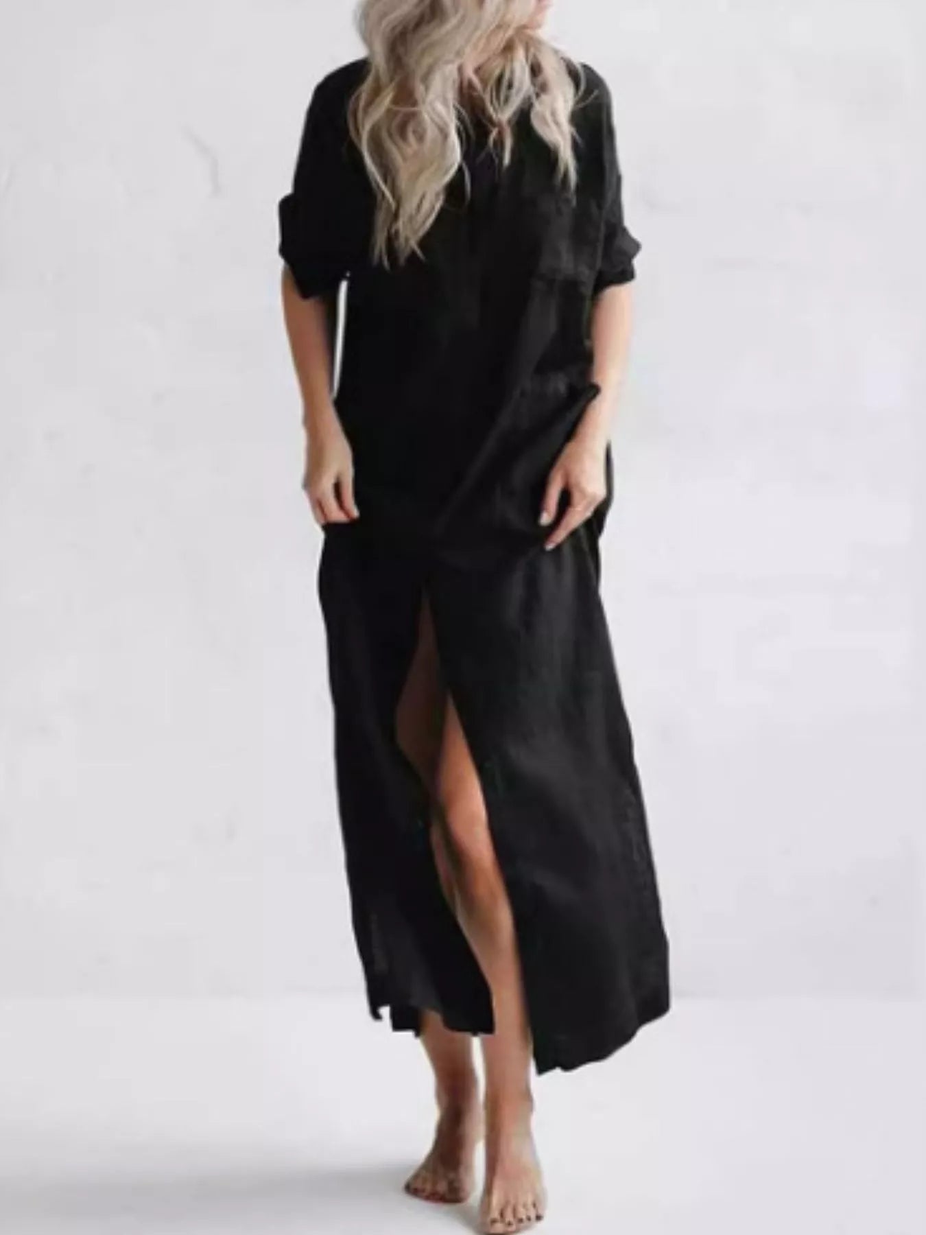 Plus-size green maxi shirt dress with collared neckline, button front, rolled sleeves, pockets, and side slit