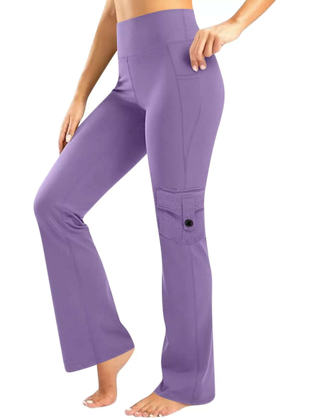 A model wears purple high-waisted yoga pants with a relaxed straight-leg silhouette, hip pockets, and a buttoned thigh pocket while posing with one leg bent.