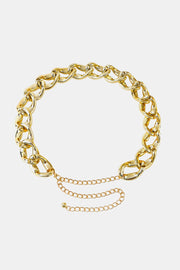 Gold-tone acrylic curb chain belt featuring bold interlocking links, a 1.2-inch width, and a draped chain extension for adjustable waist or hip styling.