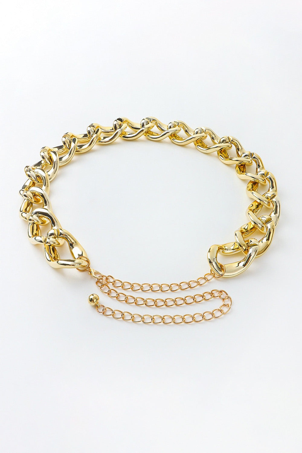 Gold-tone acrylic curb chain belt featuring interlocking links, a bold 1.2-inch width, and a draped chain extension for adjustable waist or hip styling.