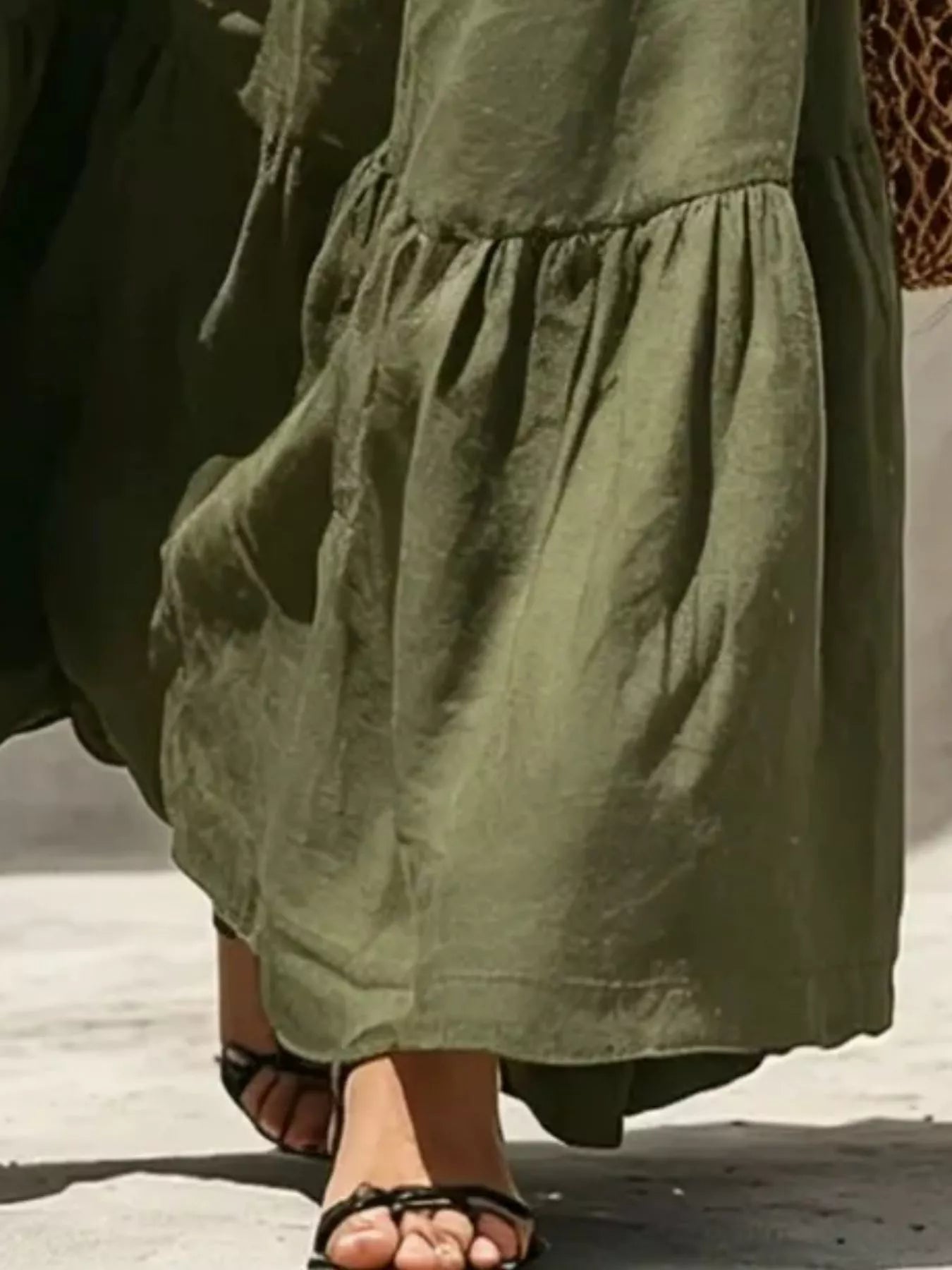 Sleeveless olive green tiered maxi dress with smocked waist and halter neckline