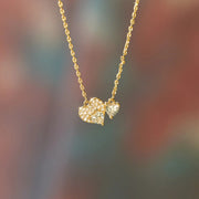18K gold-plated 925 sterling silver necklace with a delicate chain and sparkling heart-shaped zircon pendants in a romantic clustered design.
