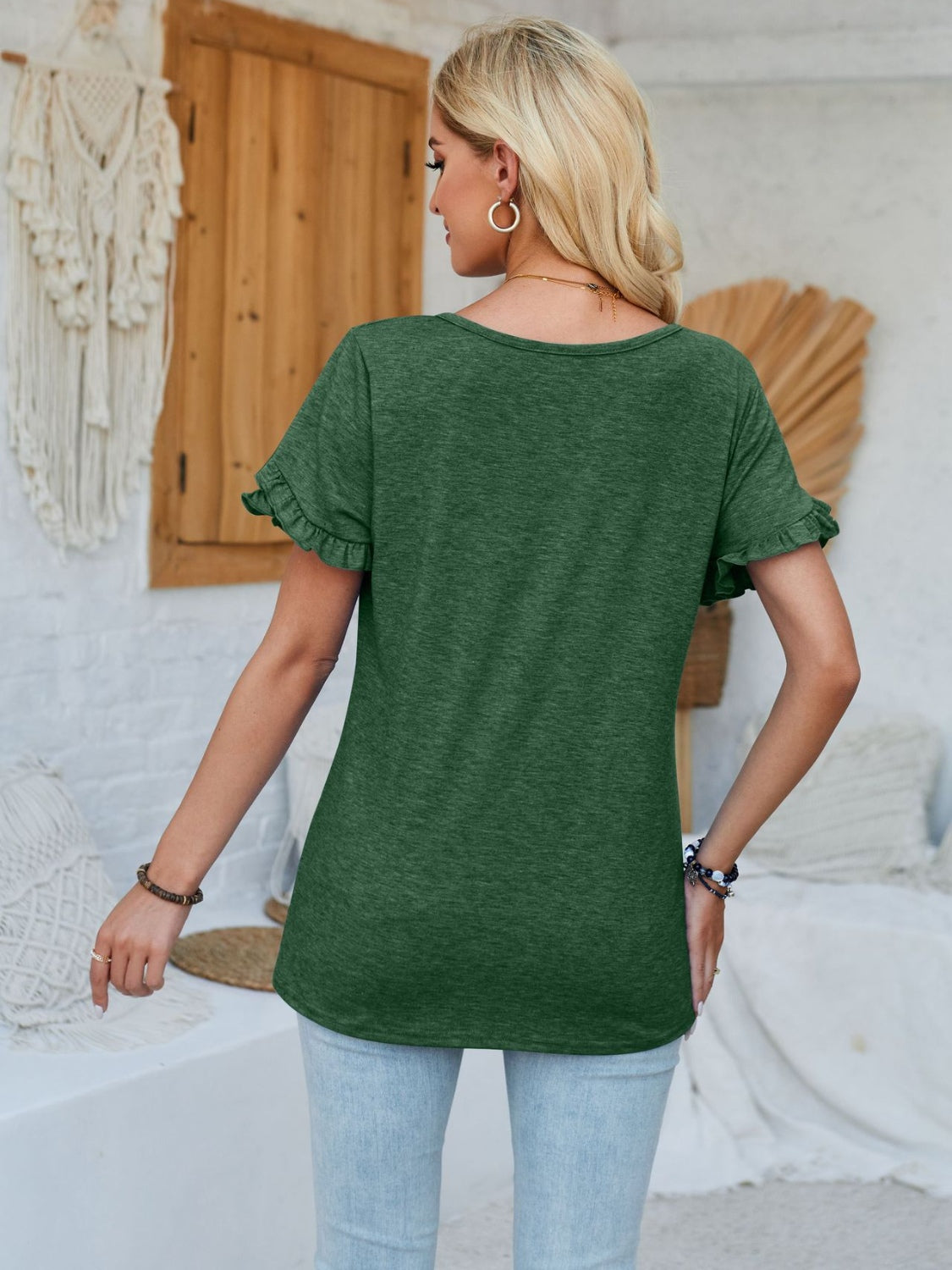 Frill round neck petal sleeve blouse.