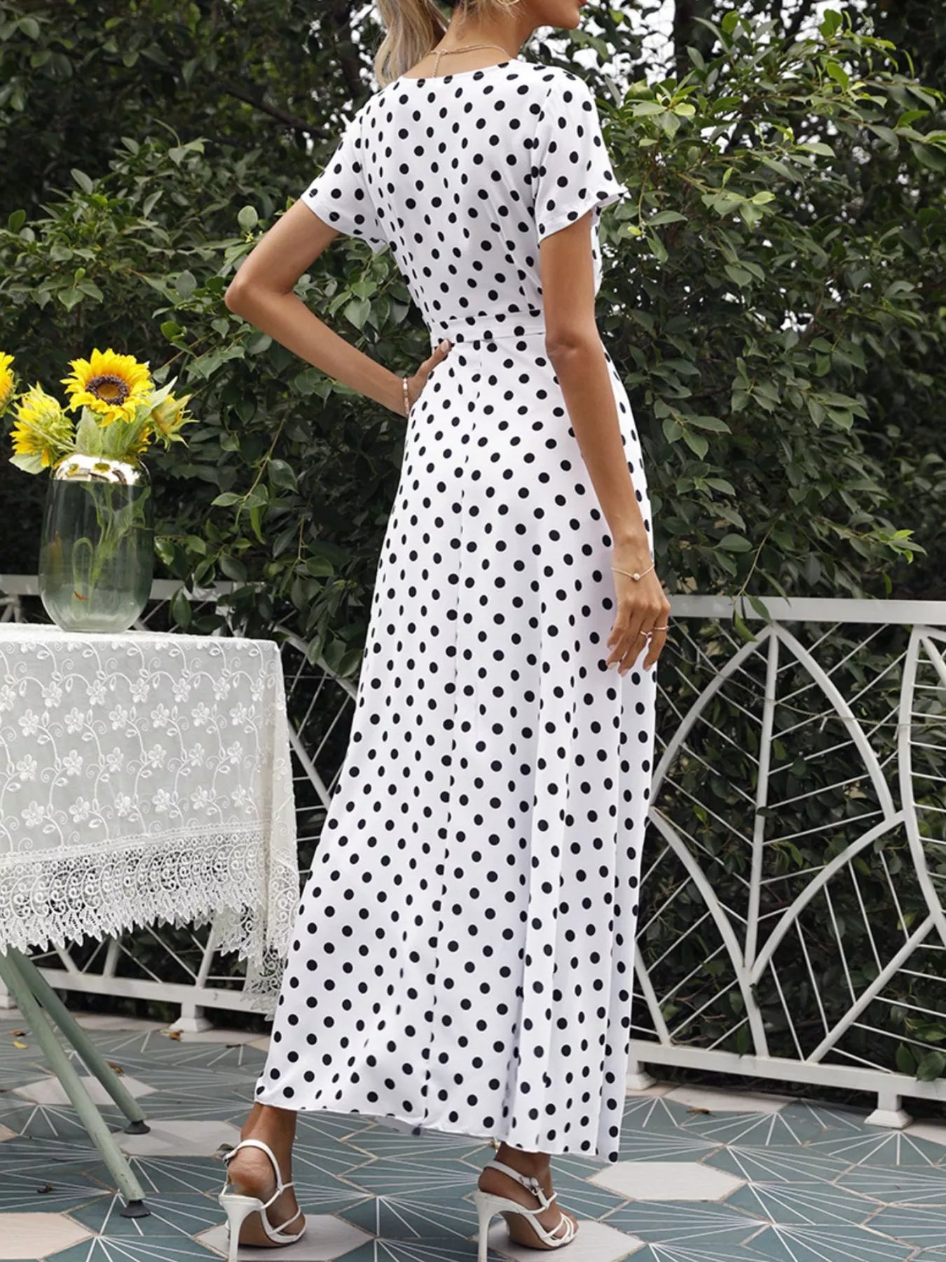 White polka dot wrap maxi dress with short sleeves, V-neck, waist tie and side slit
