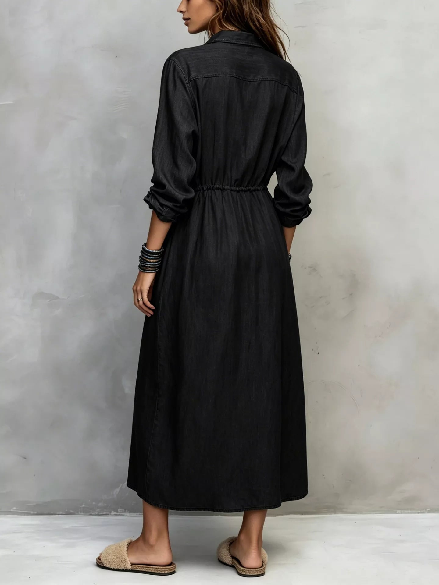 Plus size blue button-front shirt dress with long sleeves, drawstring waist, pockets, and side slit