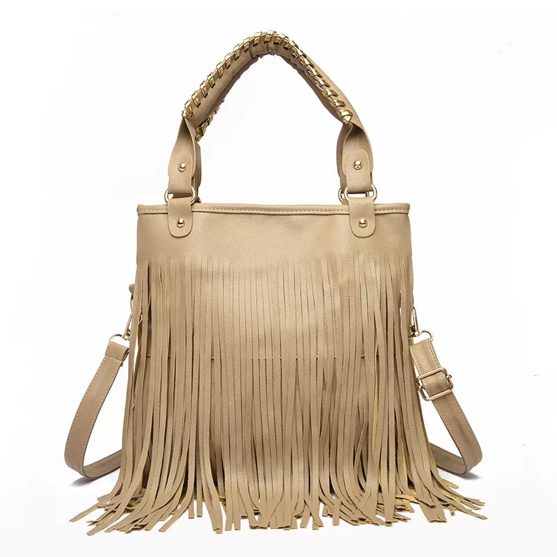 Medium beige PU leather handbag with long layered fringe, dual top handles, and a detachable shoulder strap in a structured rectangular silhouette.