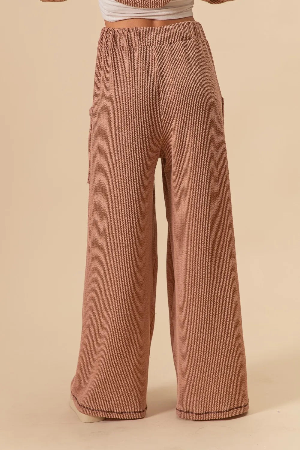 Two-tone cord ribbed waistband side pocket pants.