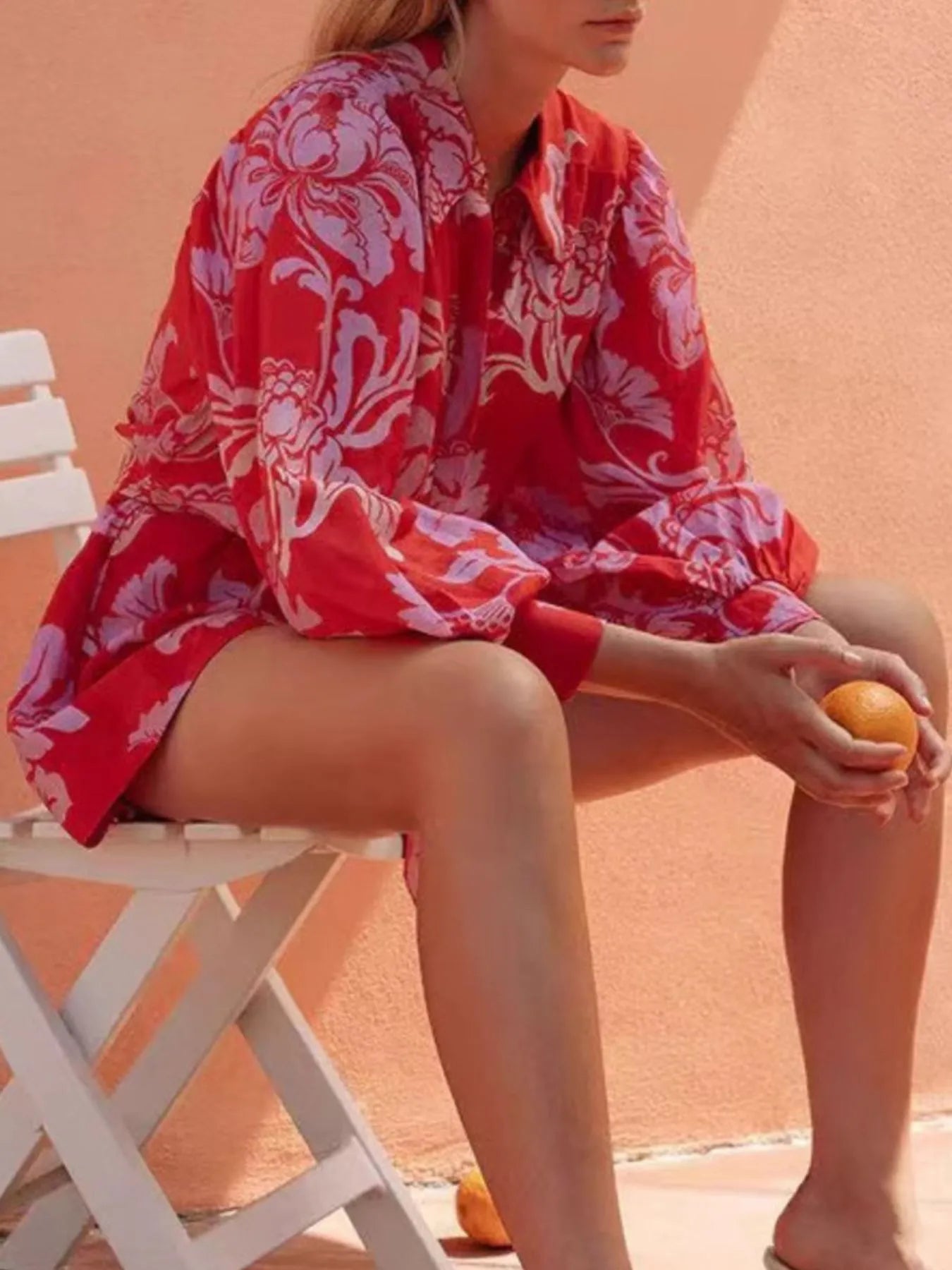 Printed Long Sleeve Belted Romper with Tie and Buttons.