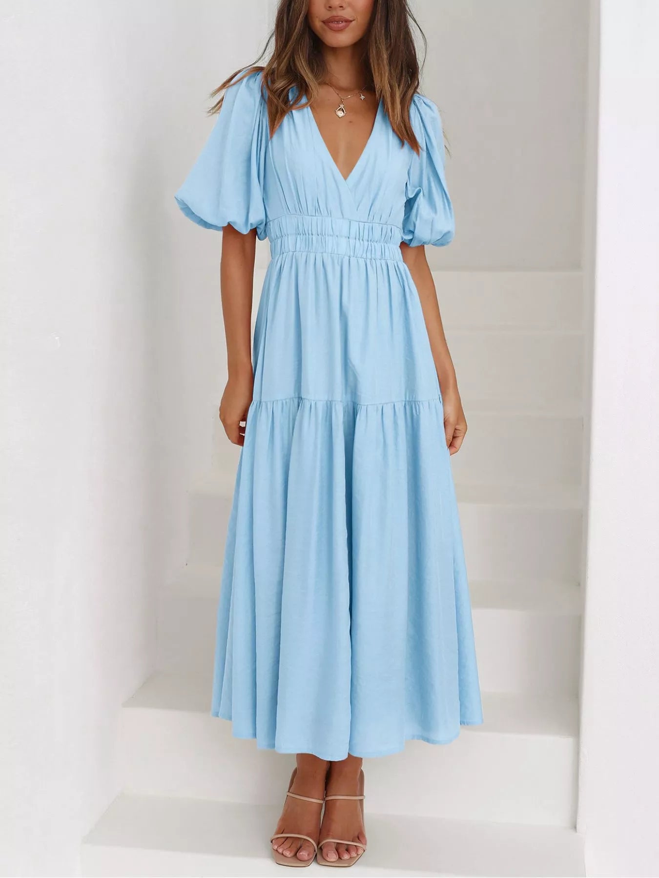 Cream tiered midi dress with a V-neck, smocked waist, and short puff sleeves