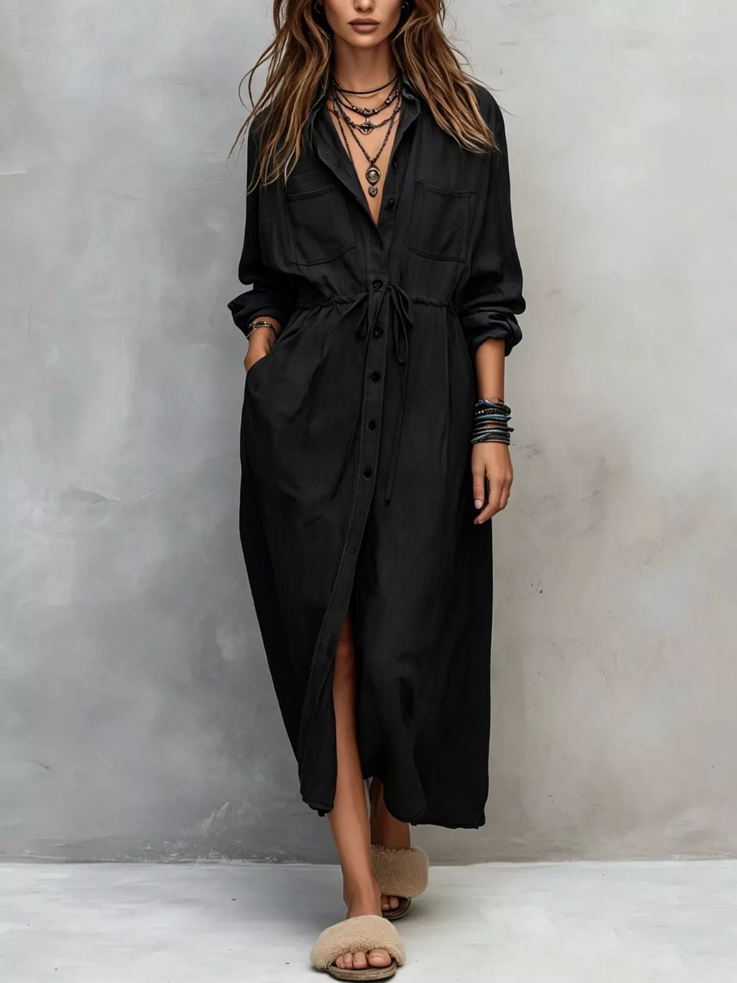 Plus size blue button-front shirt dress with long sleeves, drawstring waist, pockets, and side slit