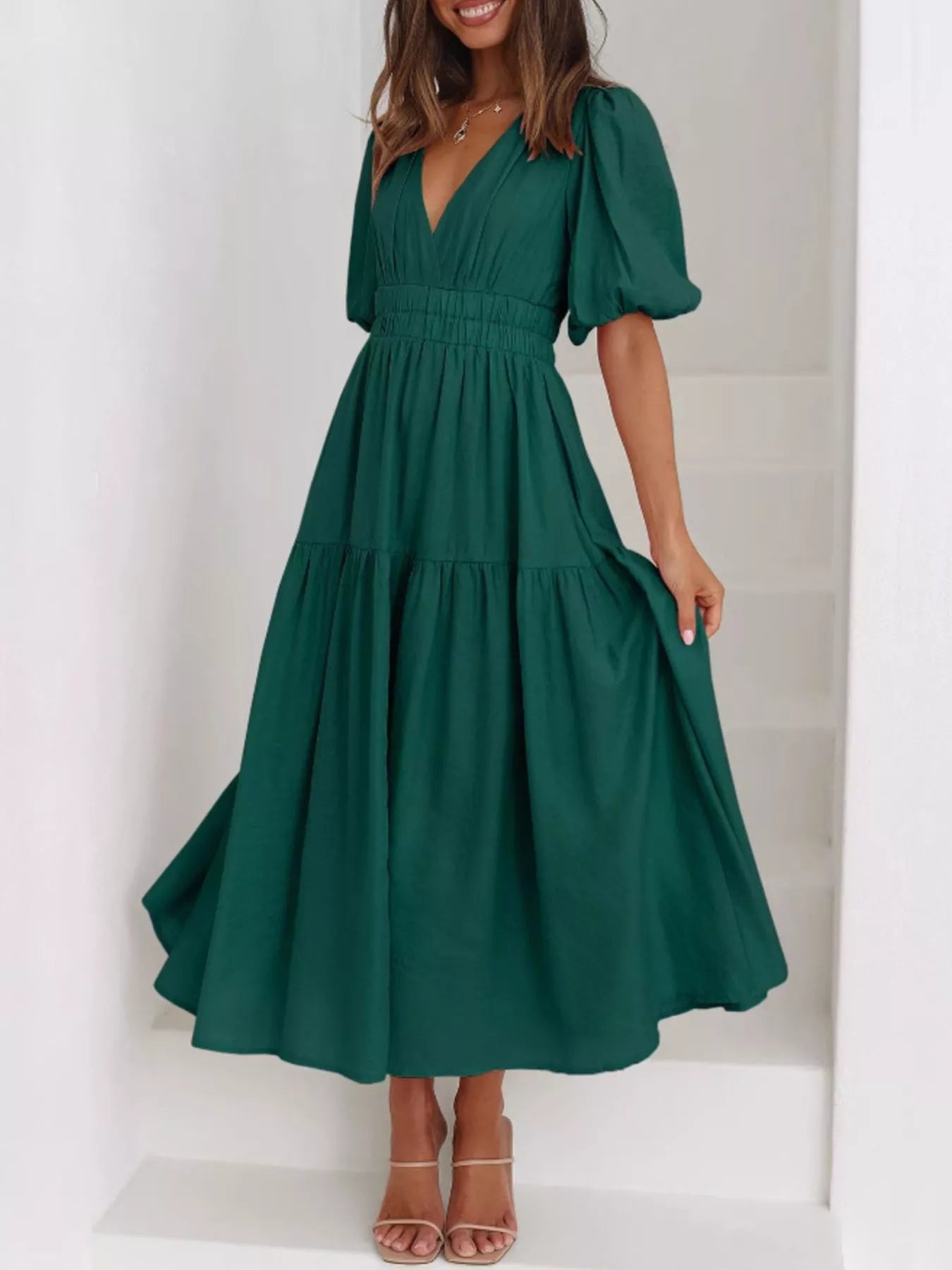 Cream tiered midi dress with a V-neck, smocked waist, and short puff sleeves