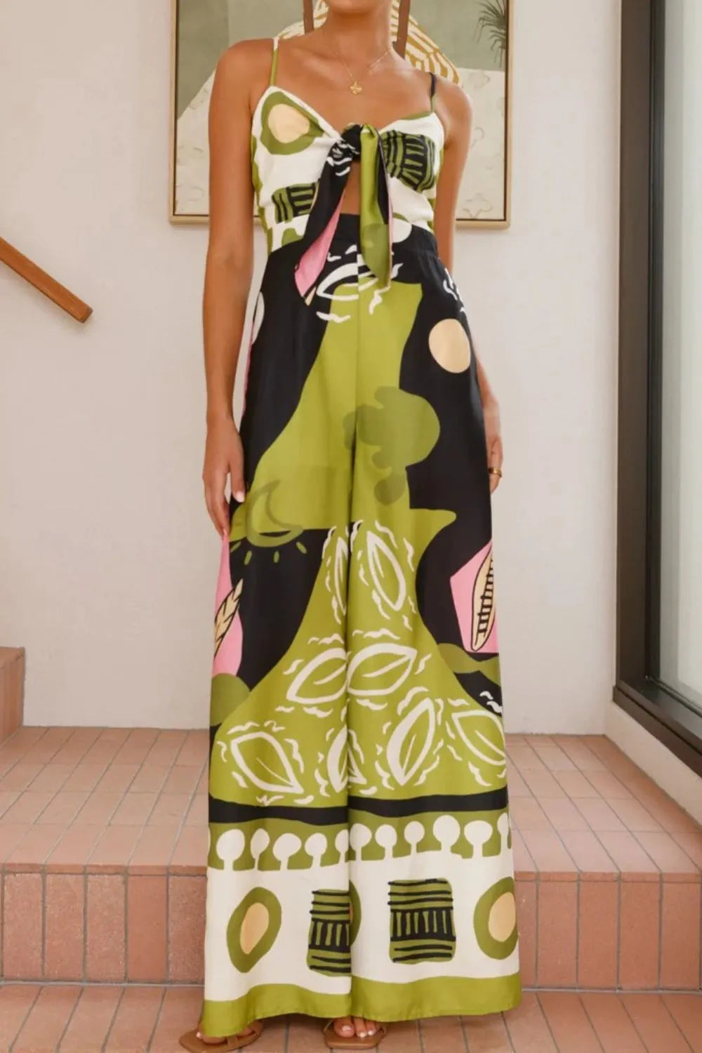 Printed Sweetheart Neck Jumpsuit with Smocked, Tie, and Pockets.