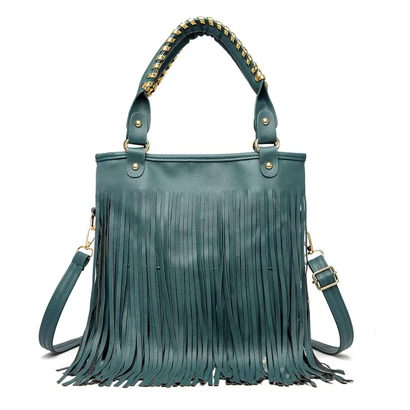 Teal PU leather handbag with a structured medium silhouette, twin top handles, detachable shoulder strap, gold-tone hardware, and long cascading fringe.