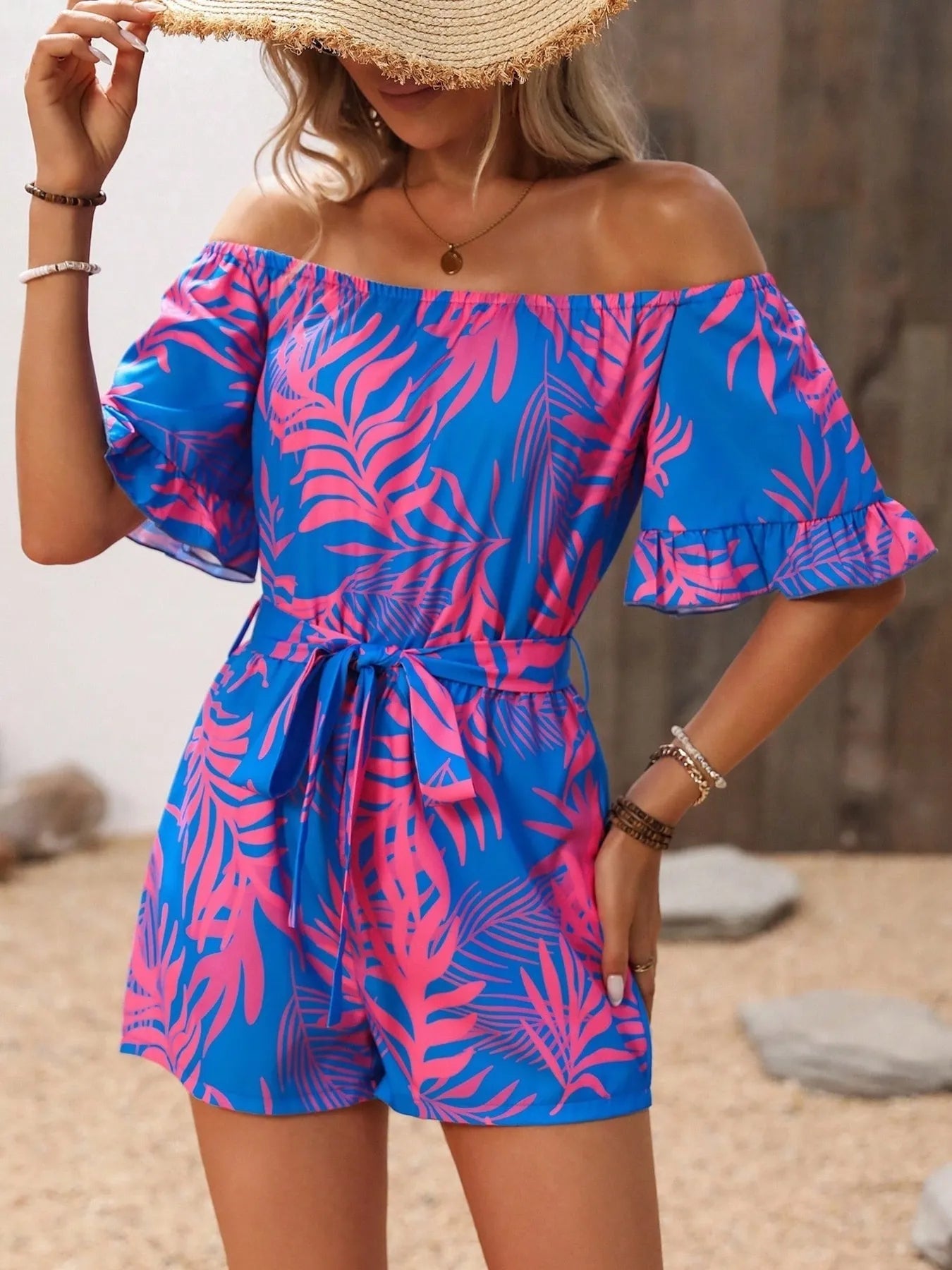 Tropical Print Off-Shoulder Romper with Tie and Ruffles.