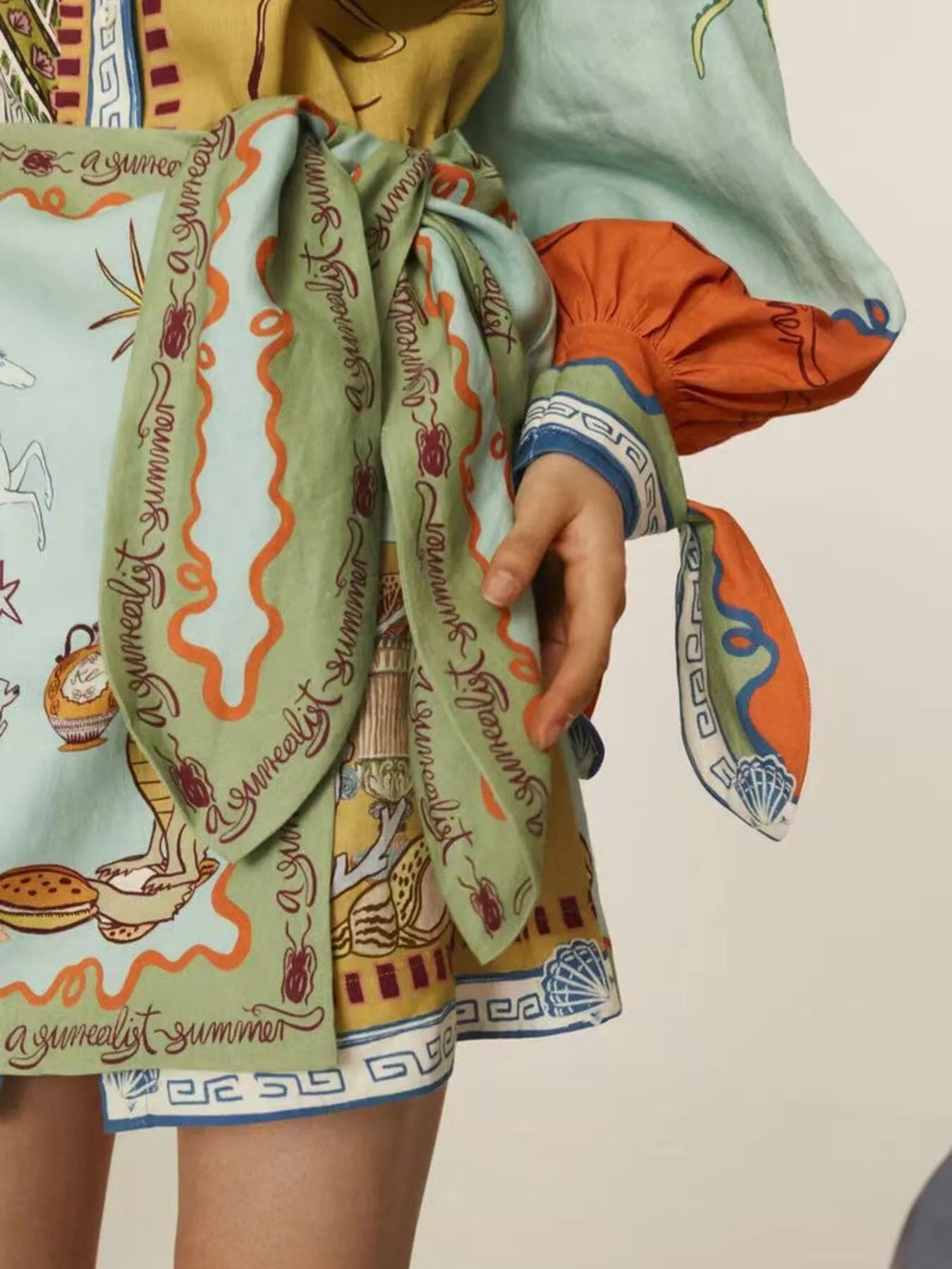 Printed Notched Neck Flutter Sleeve Mini Dress with Ruffles.