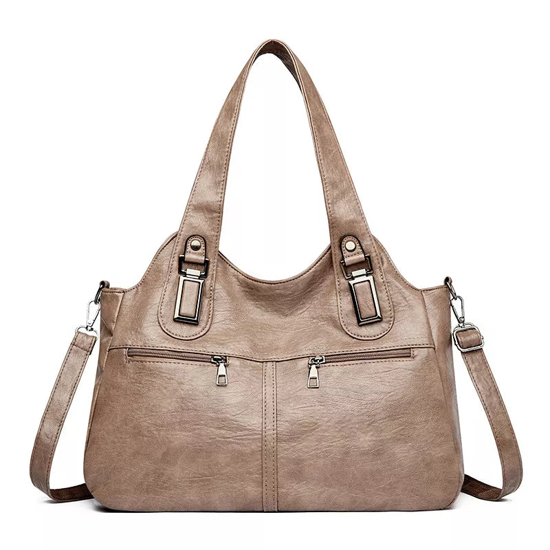 Large vintage-style taupe PU leather handbag with a slouchy silhouette, double shoulder handles, detachable strap, metal accents, and dual front zip pockets.