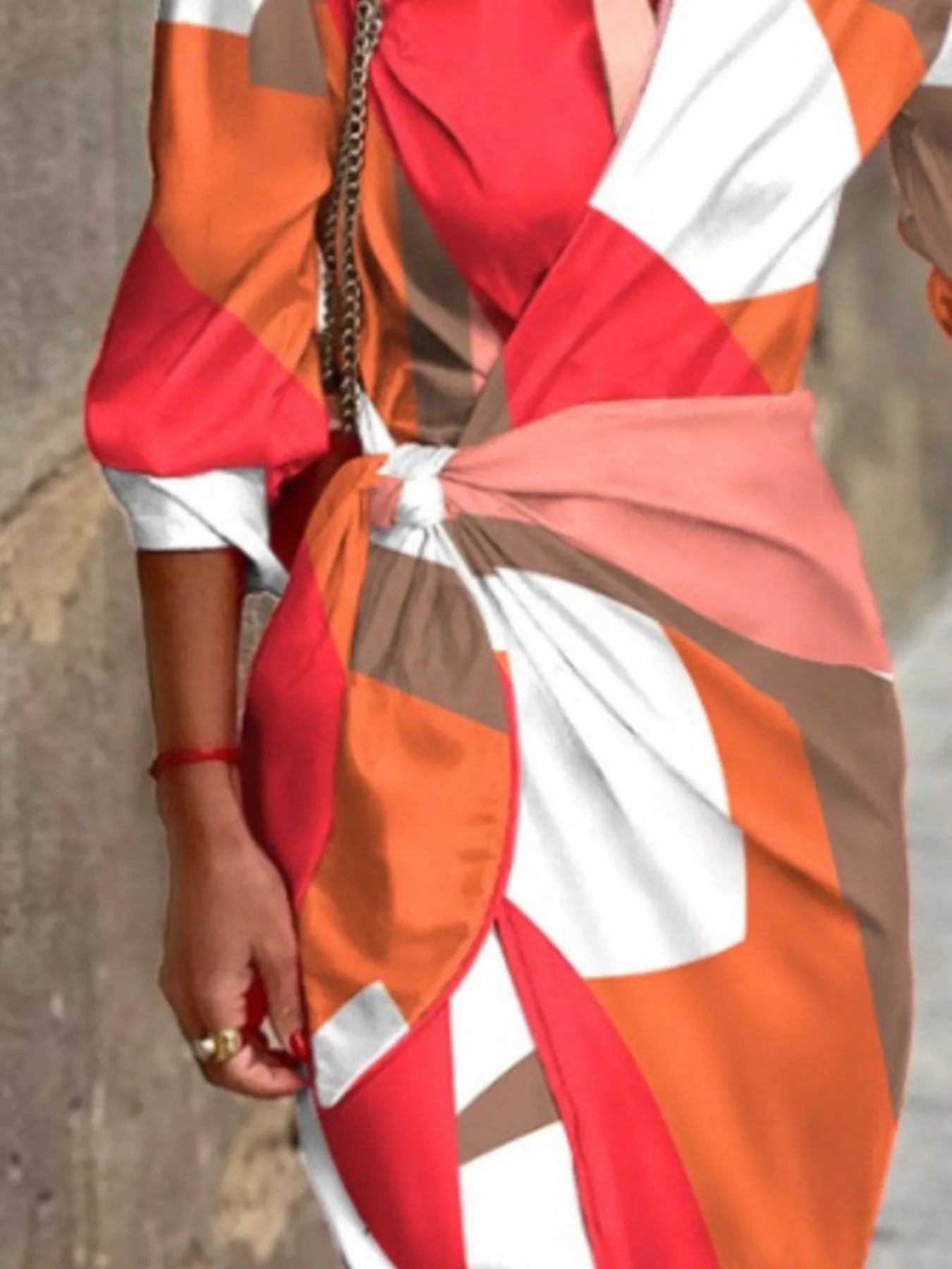 Green and red abstract-print collared midi shirt dress with three-quarter sleeves and a tied waist