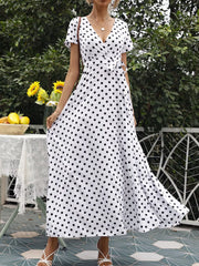 White polka dot wrap maxi dress with short sleeves, V-neck, waist tie and side slit