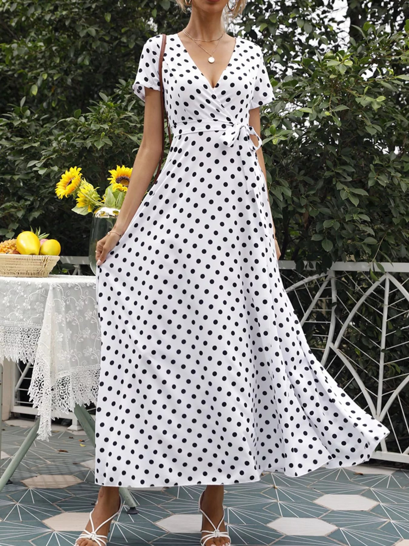 White polka dot wrap maxi dress with short sleeves, V-neck, waist tie and side slit