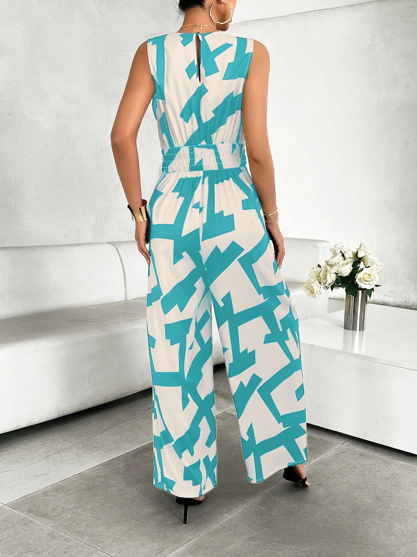 Printed Wide Leg Jumpsuit with Tie and Pockets.