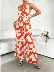 Printed Wide Leg Jumpsuit with Tie and Pockets.