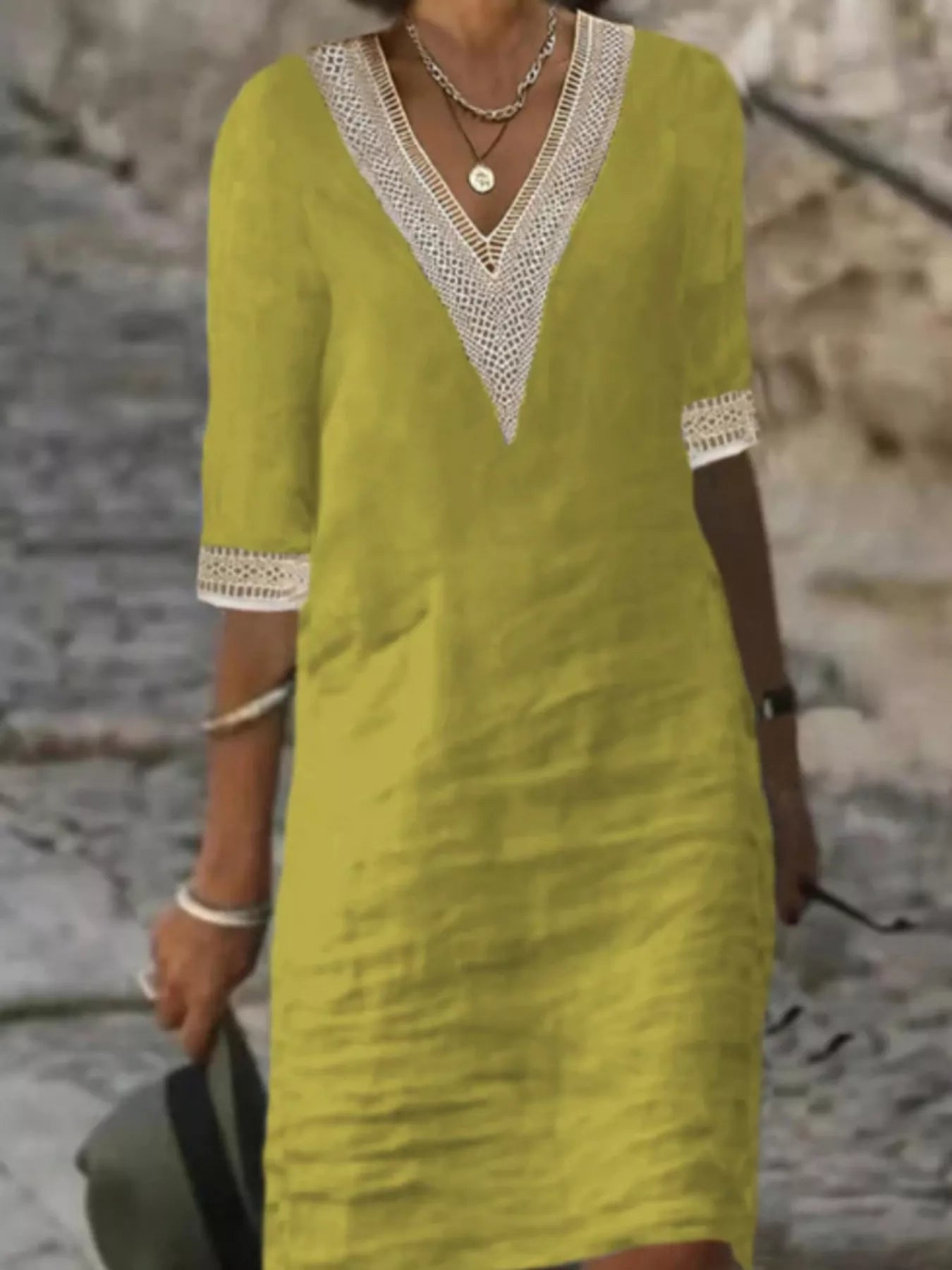 Plus-size white V-neck dress with lace trim and half sleeves