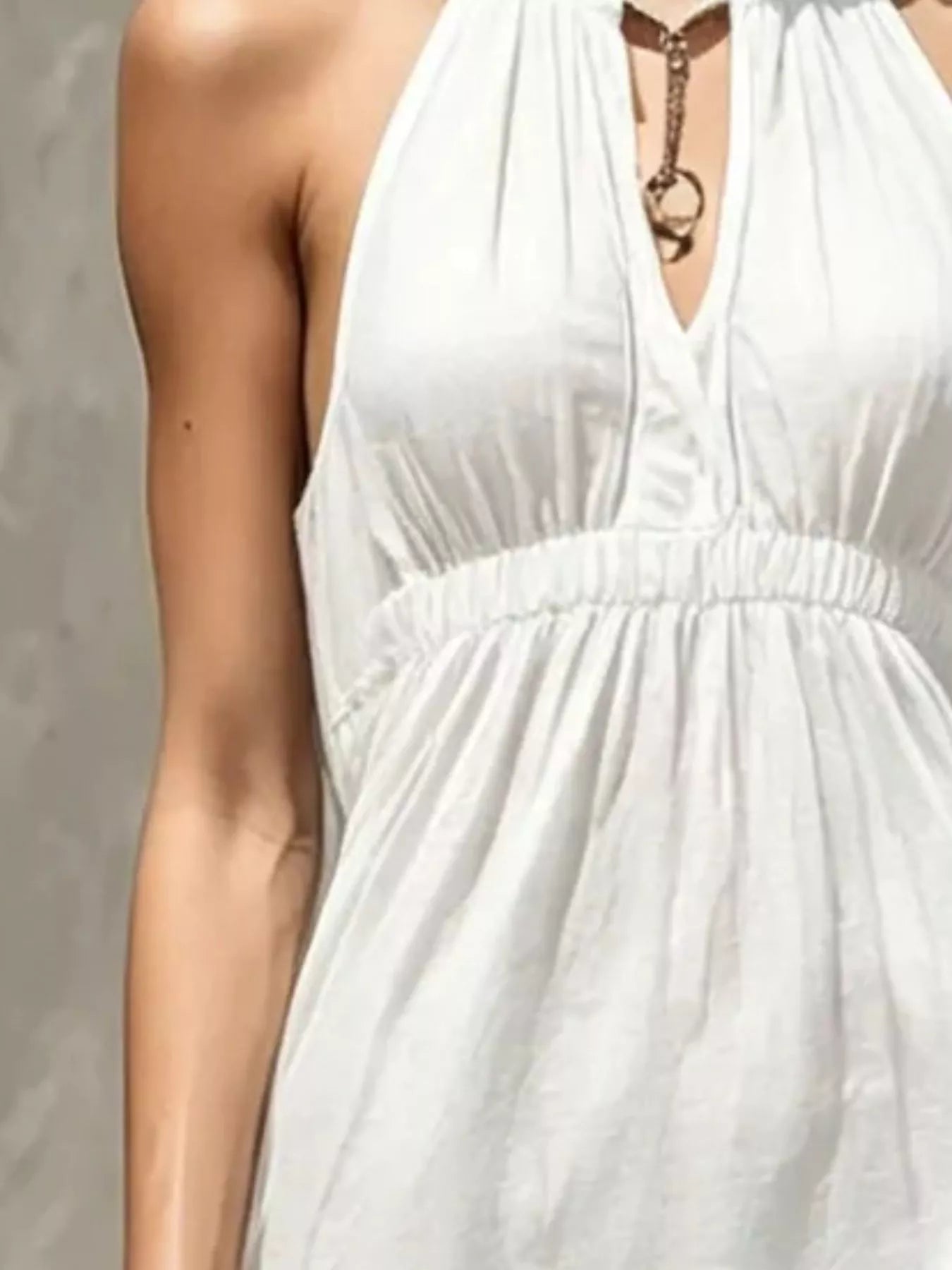 Sleeveless olive green tiered maxi dress with smocked waist and halter neckline