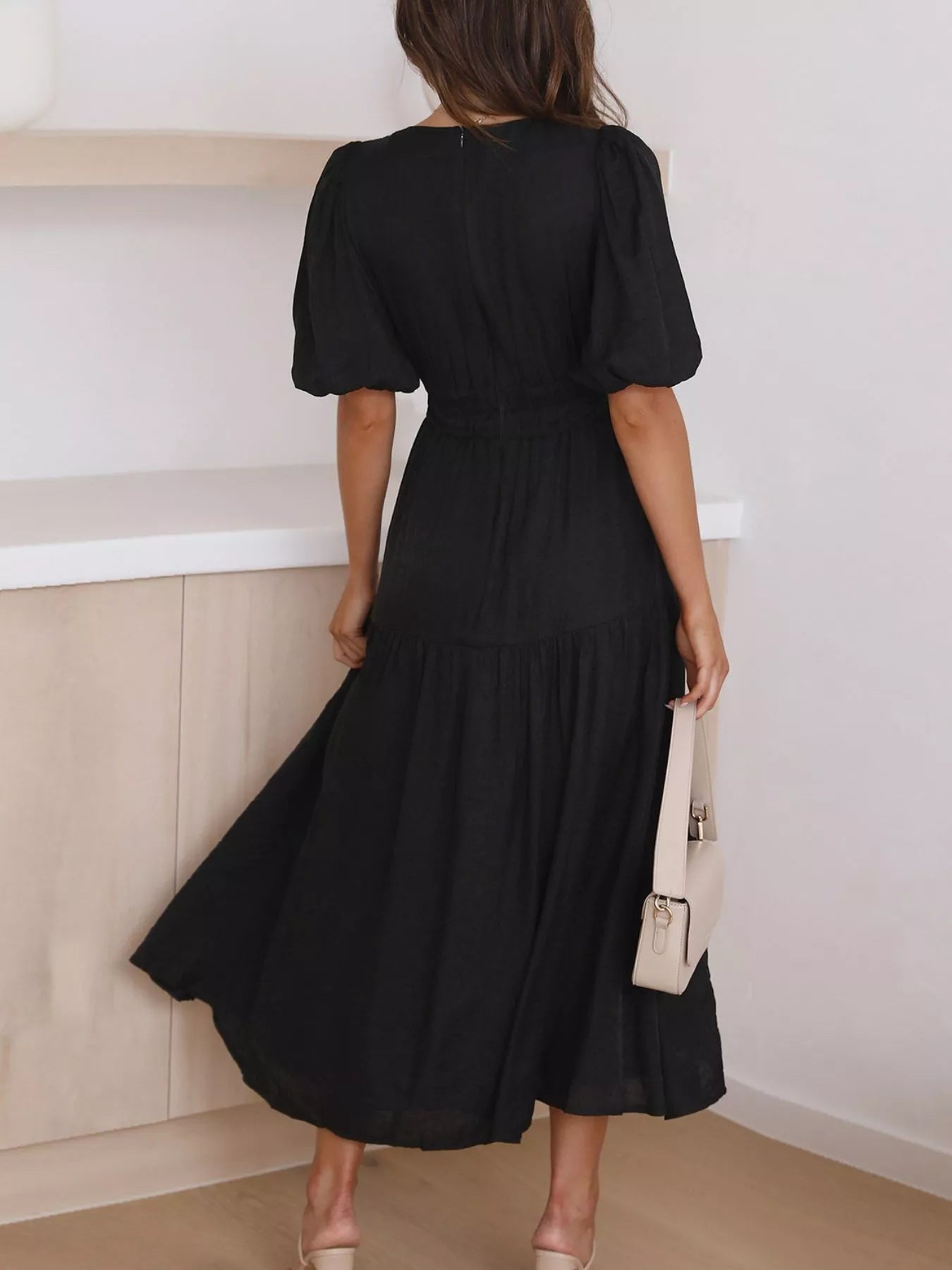 Cream tiered midi dress with a V-neck, smocked waist, and short puff sleeves