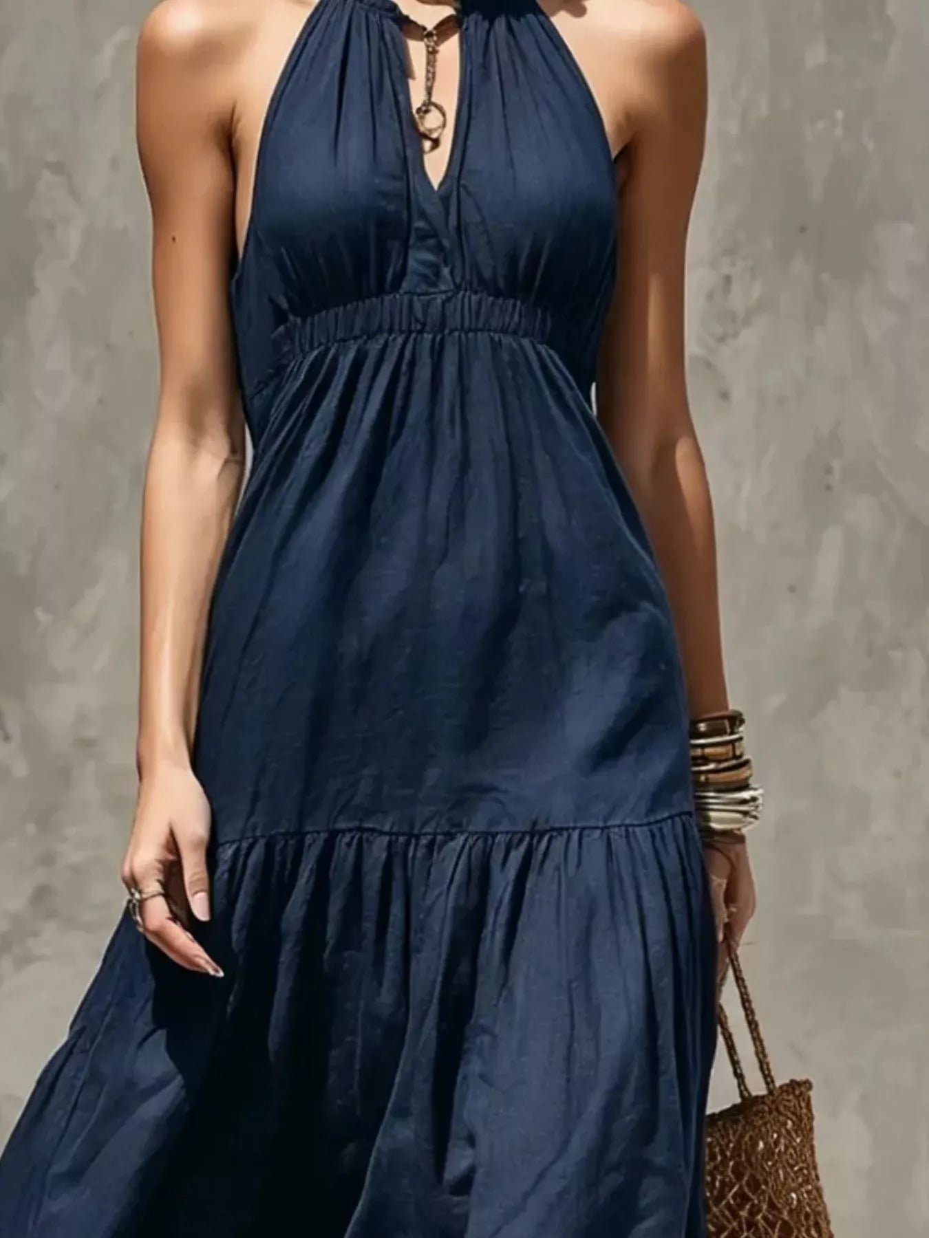 Sleeveless olive green tiered maxi dress with smocked waist and halter neckline