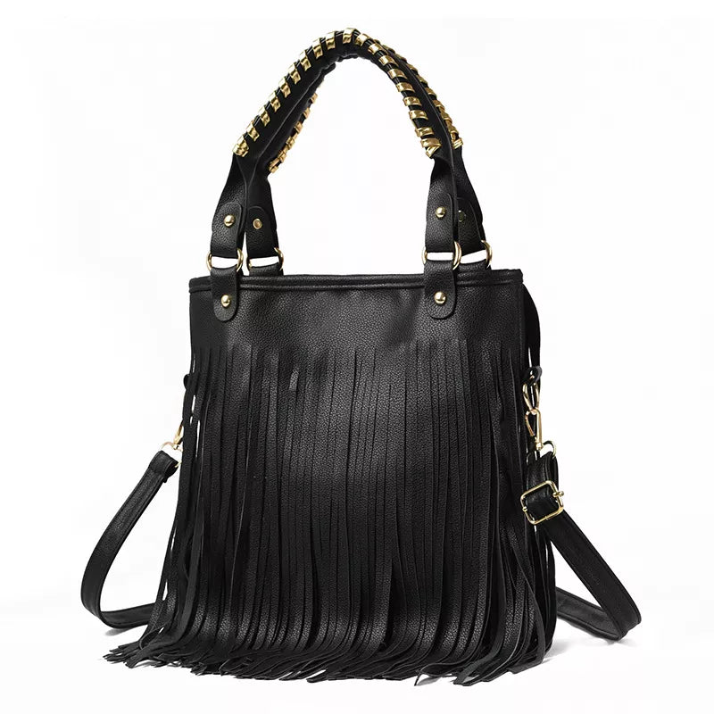 Black medium PU leather handbag with a structured tote silhouette, dual top handles, gold-tone hardware, long shoulder strap, and cascading fringe.