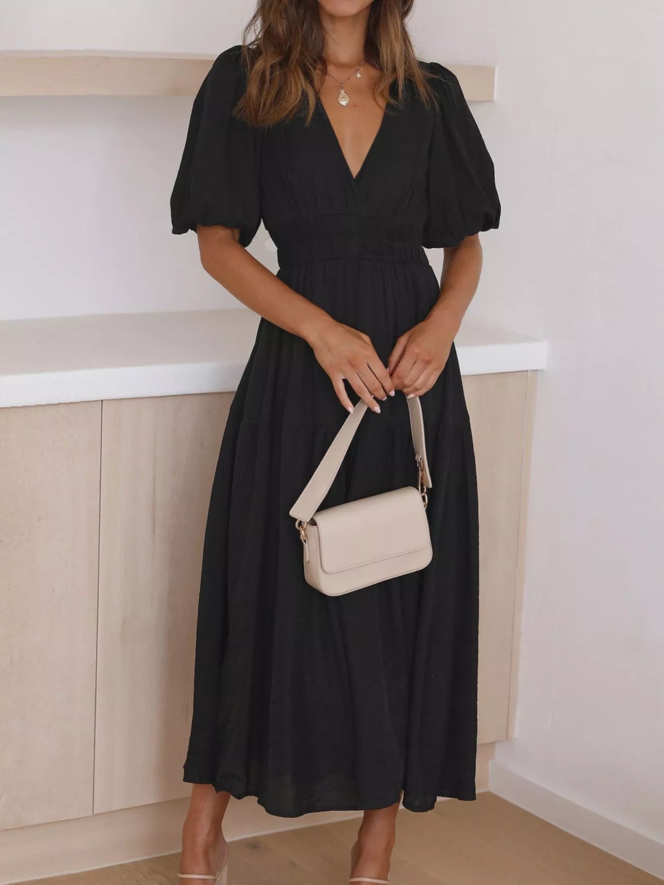 Cream tiered midi dress with a V-neck, smocked waist, and short puff sleeves