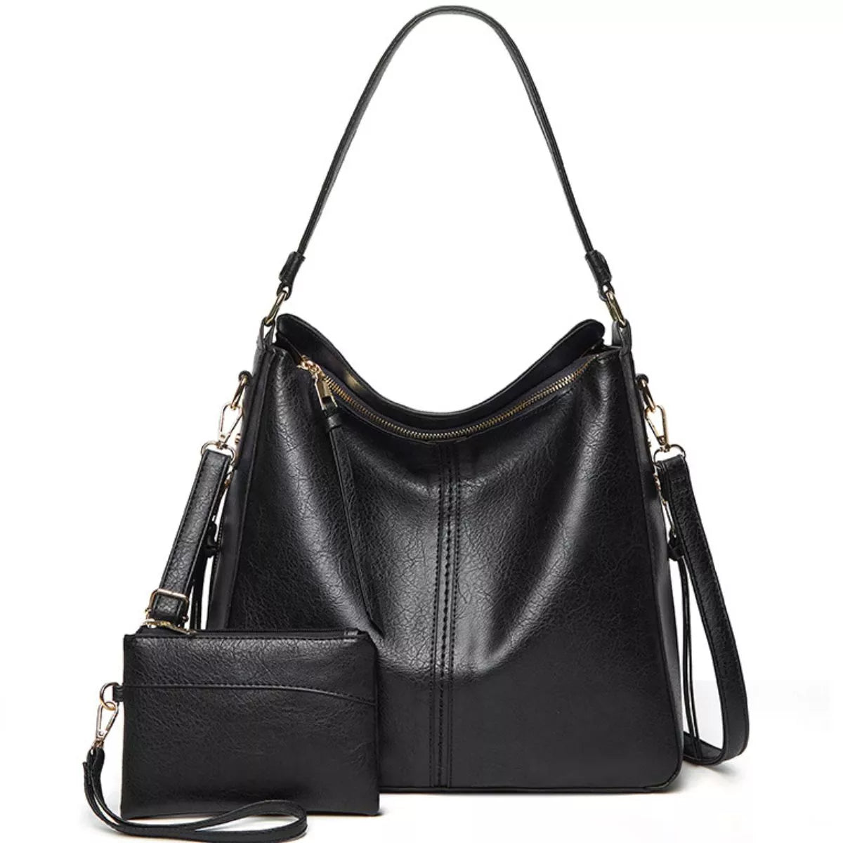 Black medium PU leather crossbody bag with a softly structured silhouette, curved zip top, long straps, gold-tone hardware, and a detachable matching pouch.