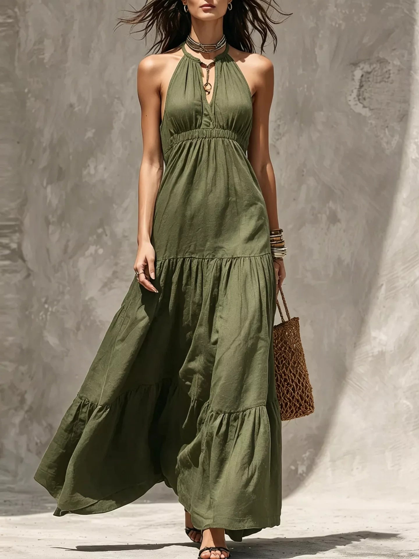Sleeveless olive green tiered maxi dress with smocked waist and halter neckline