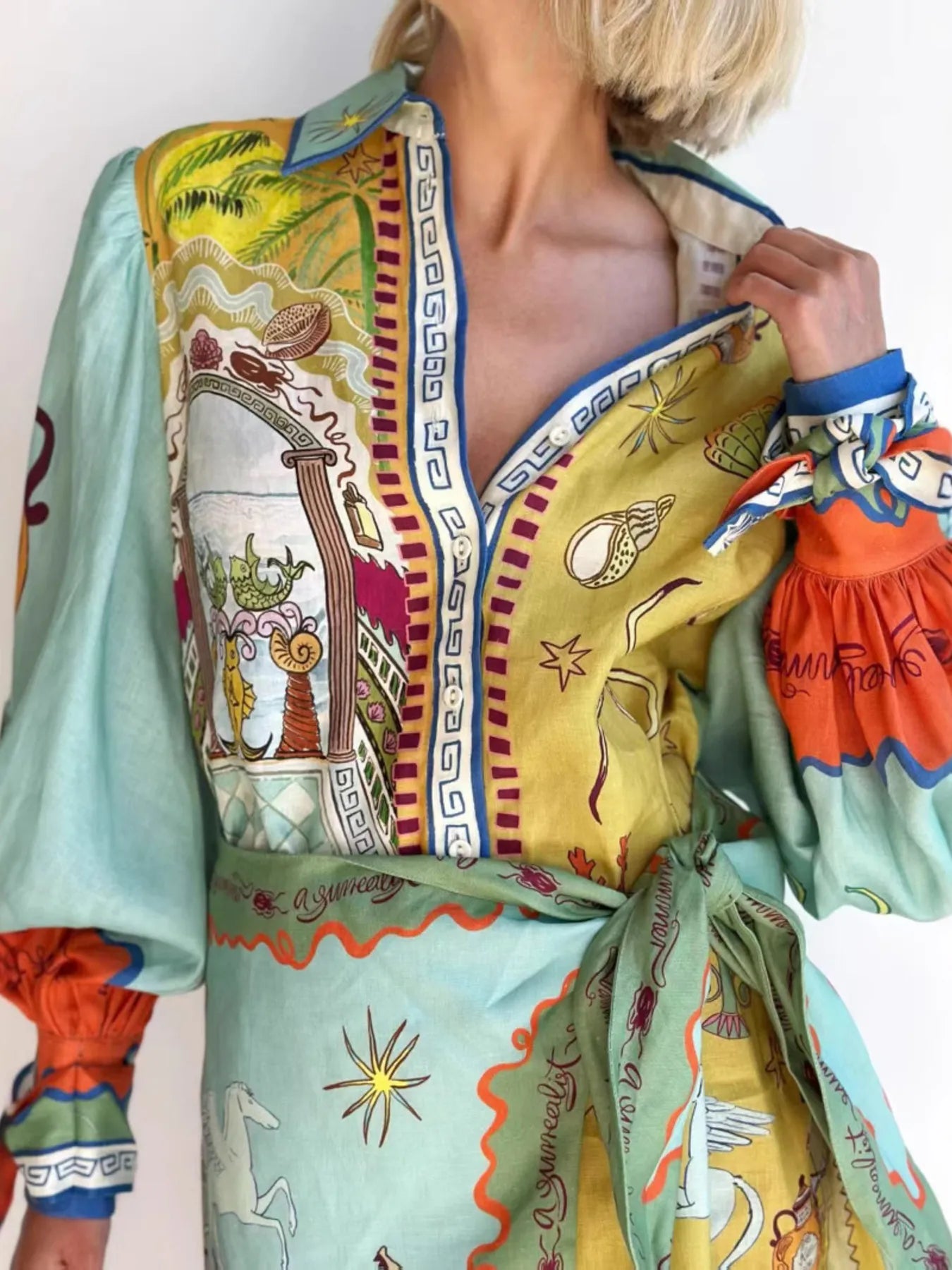 Printed Notched Neck Flutter Sleeve Mini Dress with Ruffles.