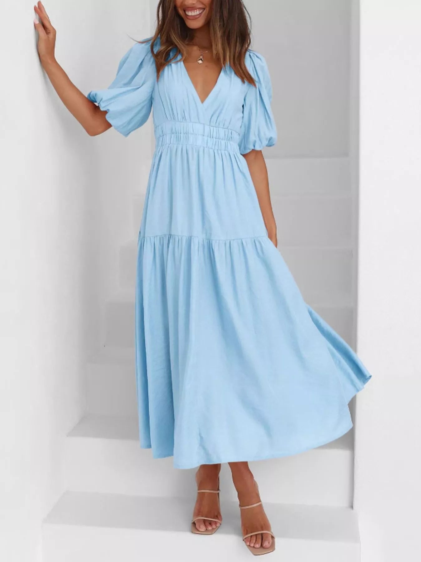 Cream tiered midi dress with a V-neck, smocked waist, and short puff sleeves