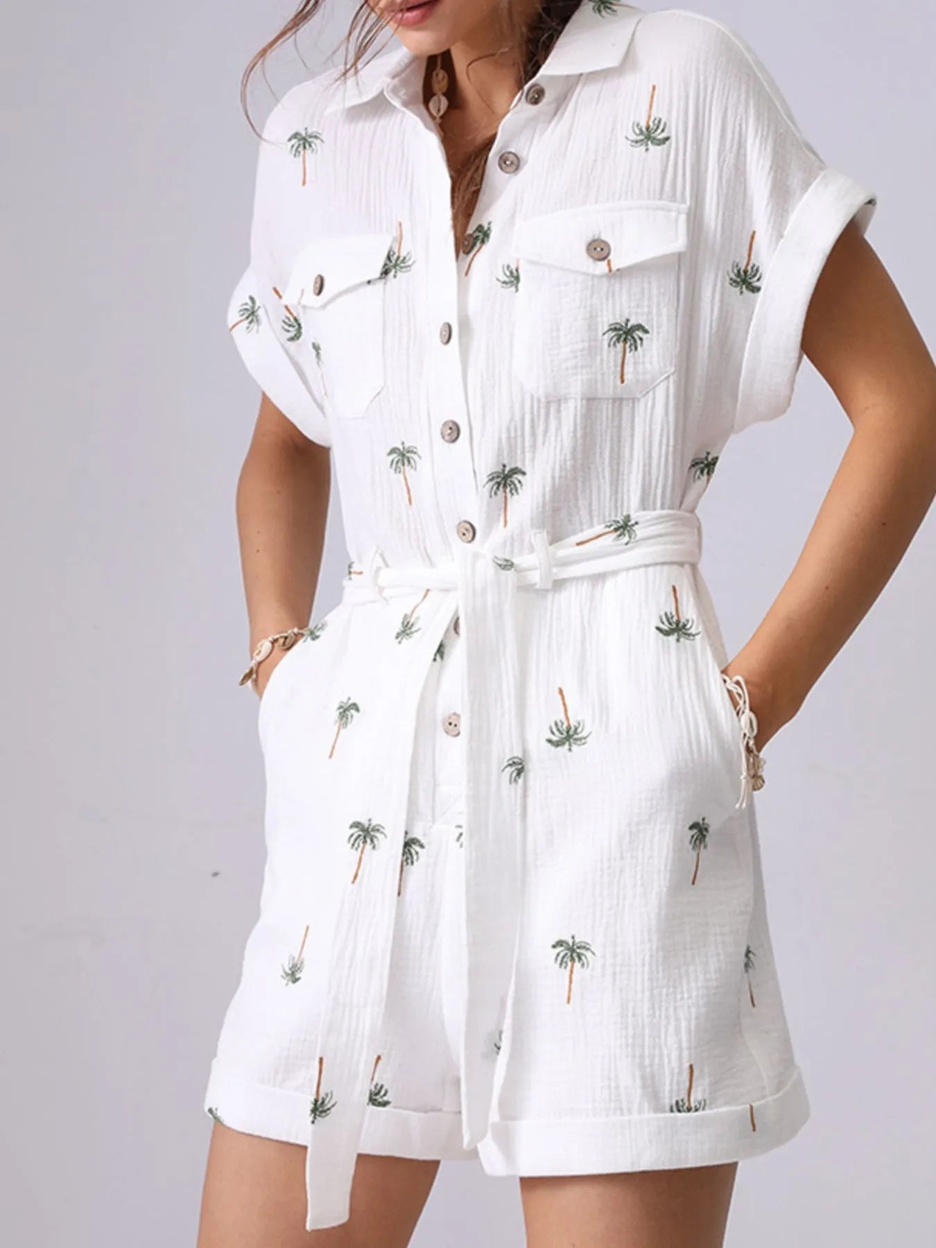 Palm Tree Print Short Sleeve Button-Up Romper with Belt and Pockets.