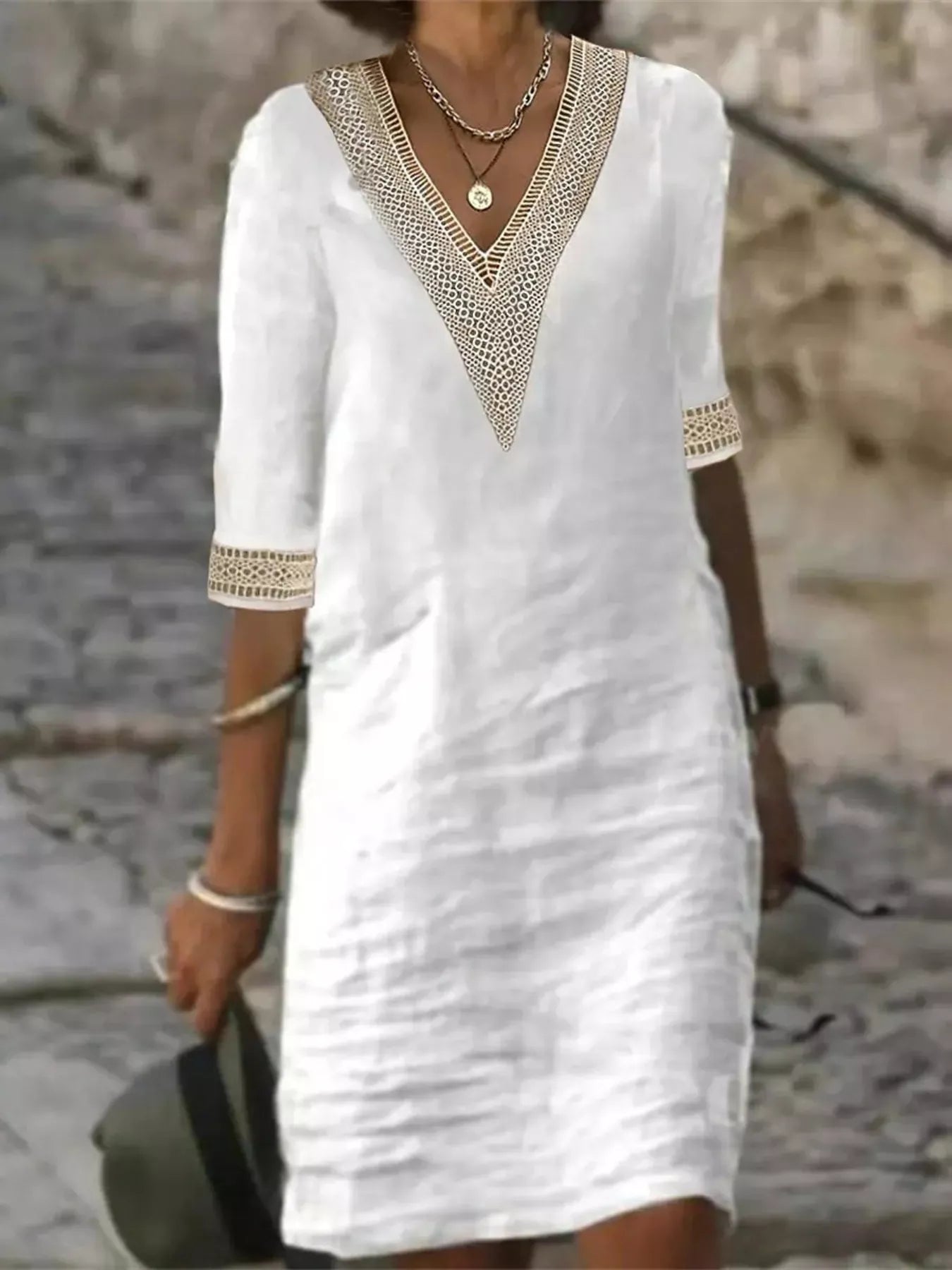 Plus-size white V-neck dress with lace trim and half sleeves