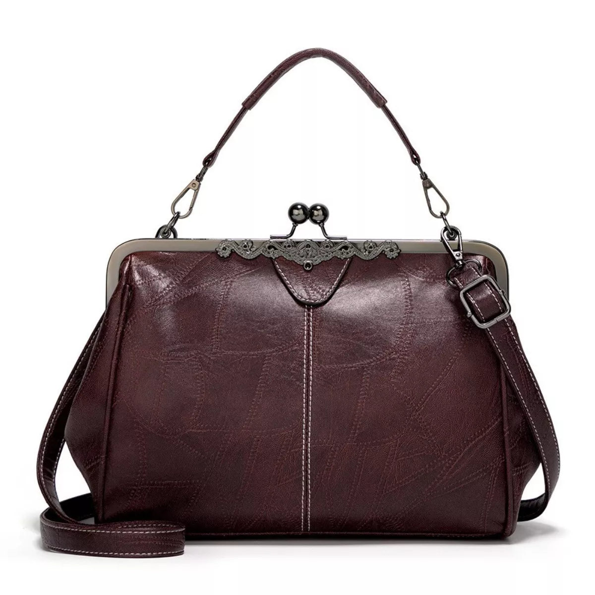 Medium vintage burgundy PU leather handbag with a structured rectangular silhouette, kiss-lock clasp, top handle, adjustable shoulder strap, and metal frame.