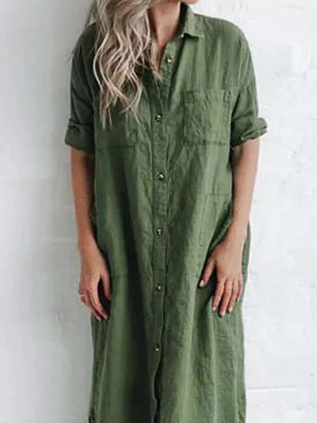 Plus-size green maxi shirt dress with collared neckline, button front, rolled sleeves, pockets, and side slit