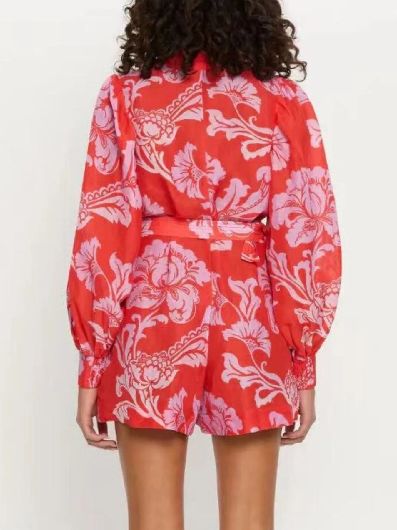 Printed Long Sleeve Belted Romper with Tie and Buttons.