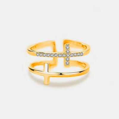 Adjustable 18K gold-plated 925 sterling silver cross ring featuring a polished open silhouette, horizontal zircon accents, and a distinctive layered design.