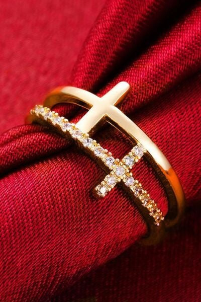 A 925 sterling silver cross ring with 18K gold plating, a polished open band, and sparkling zircon accents forming a distinctive layered cross design.