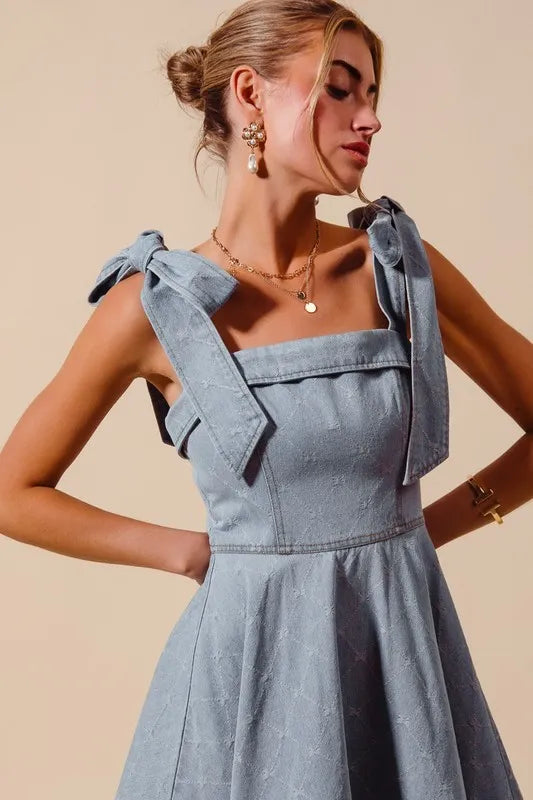 A-Line Fit and Flare Diamond Bow Ribbon Denim Dress with Tied Bow.