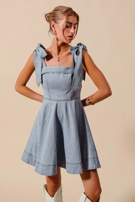 A-Line Fit and Flare Diamond Bow Ribbon Denim Dress with Tied Bow.
